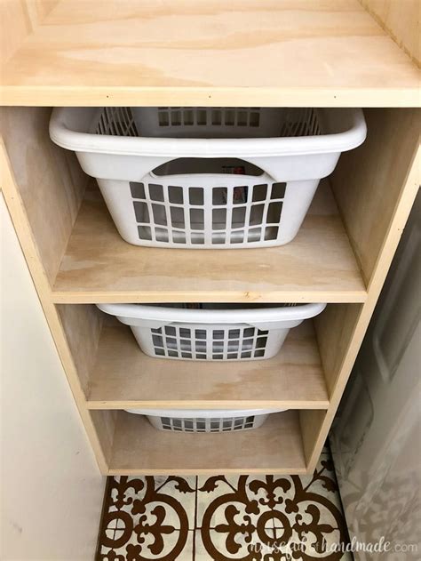 metal box in laundry closet|laundry basket organizer.